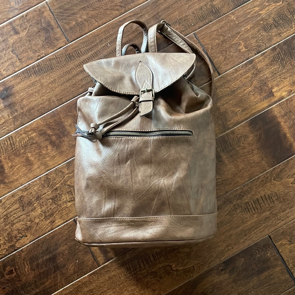Faux leather backpack with adjustable straps floral lining/ outside zipper
